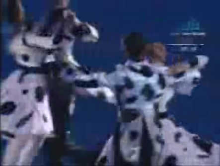 Dancing skaters in holstein costumes at the 2006 Winter Olympic opening ceremony.