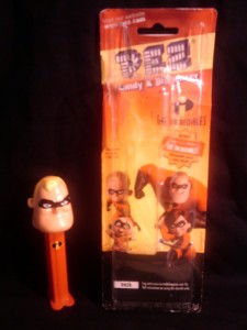 A Mr Incredible PEZ dispenser and its (empty) package.